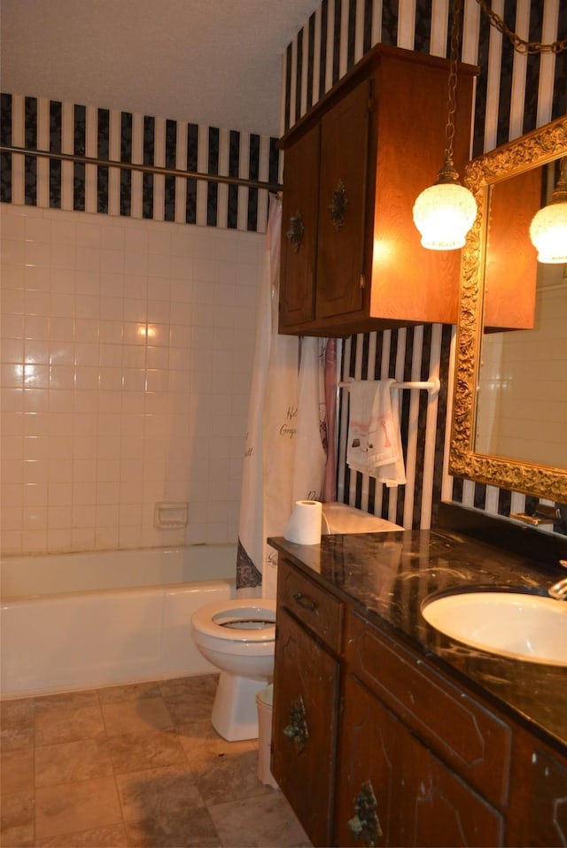 full bathroom with vanity, shower / bathtub combination with curtain, and toilet