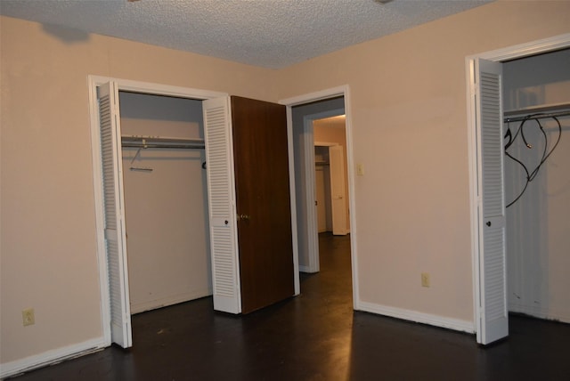 unfurnished bedroom with a textured ceiling