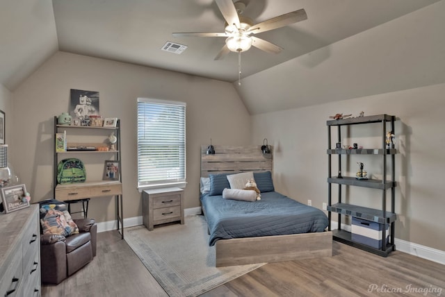 bedroom featuring vaulted ceiling, ceiling fan, and light hardwood / wood-style flooring