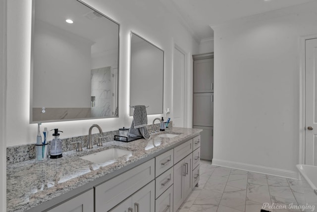 bathroom with vanity and ornamental molding