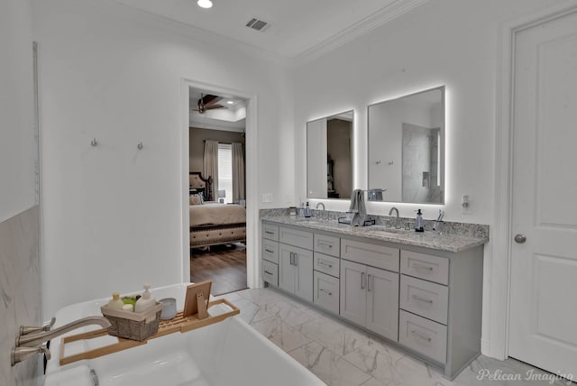 bathroom featuring vanity, ornamental molding, and ceiling fan