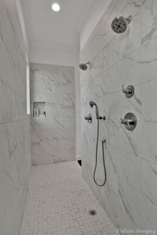 bathroom with tiled shower