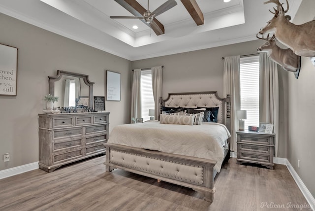 bedroom featuring multiple windows, wood-type flooring, ornamental molding, and beam ceiling