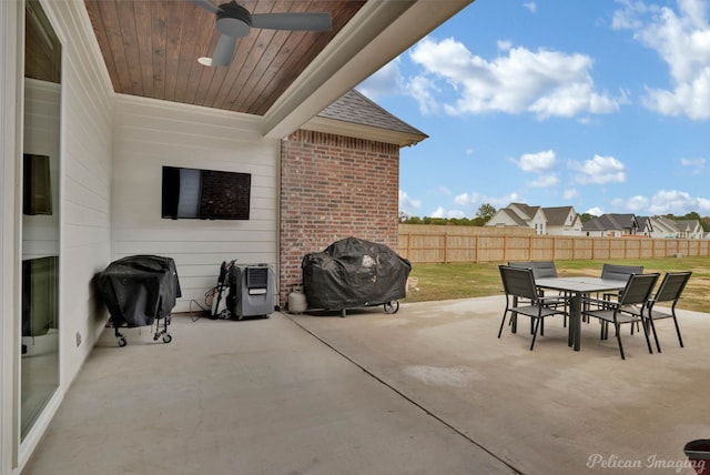 view of patio with ceiling fan and a grill