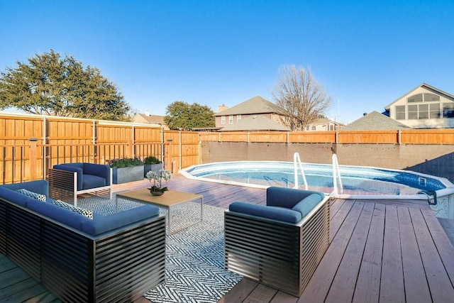 view of pool with a wooden deck and an outdoor hangout area