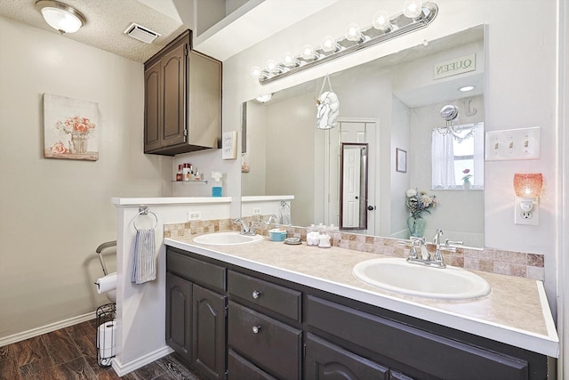 bathroom featuring vanity and hardwood / wood-style flooring