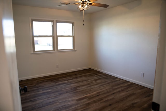 unfurnished room with ceiling fan and dark hardwood / wood-style flooring