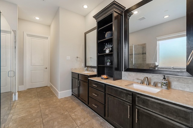 bathroom with vanity, tile patterned floors, and walk in shower