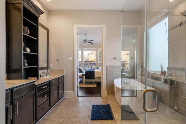 bathroom with ceiling fan, tile patterned floors, an enclosed shower, and vanity