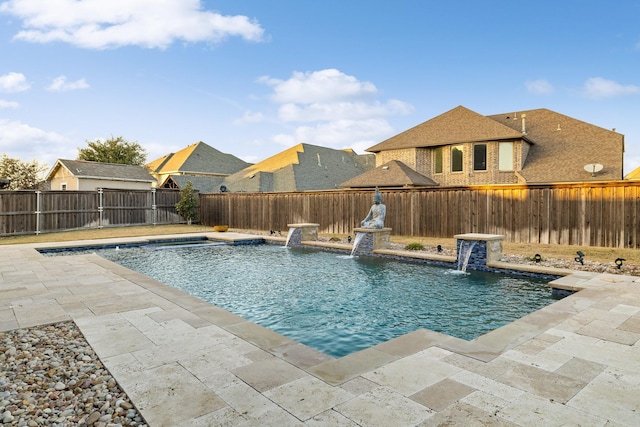 view of swimming pool with a patio area and pool water feature