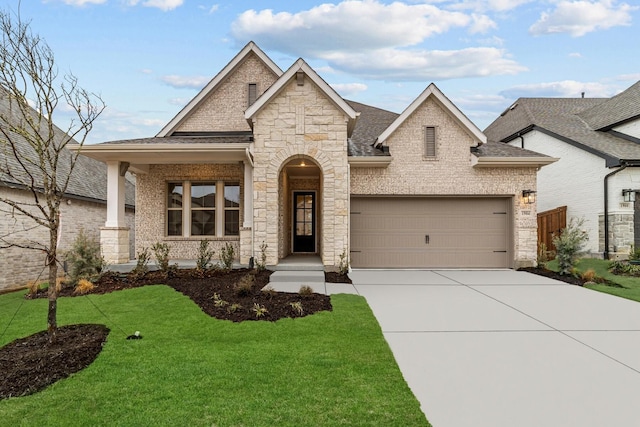 view of front of house with a garage and a front yard