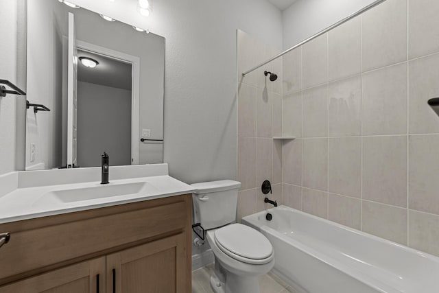 full bathroom with vanity, toilet, and tiled shower / bath combo