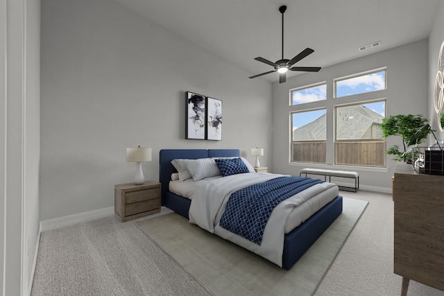 bedroom with ceiling fan and light colored carpet