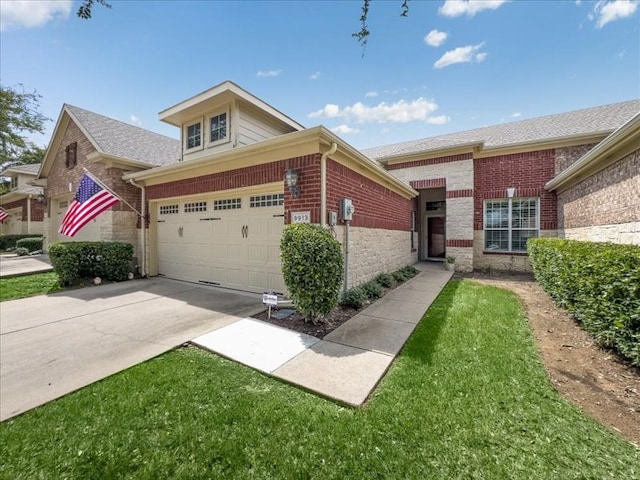 view of front of property with brick siding, driveway, and a garage