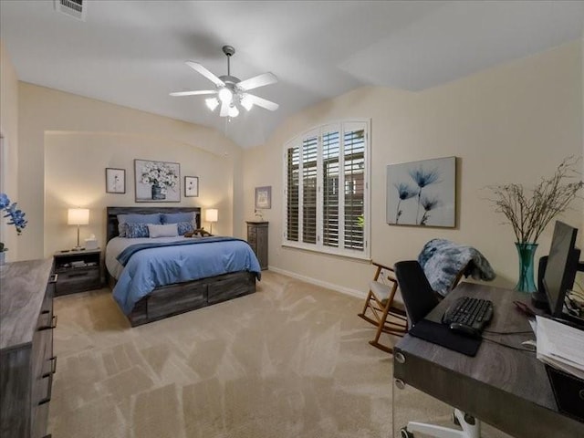 bedroom with ceiling fan, light colored carpet, and vaulted ceiling