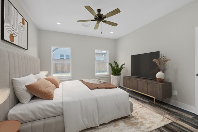 bedroom with hardwood / wood-style floors and ceiling fan