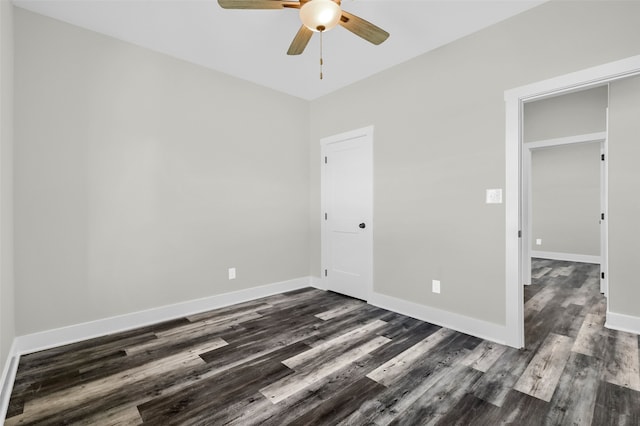 unfurnished room featuring dark hardwood / wood-style flooring and ceiling fan