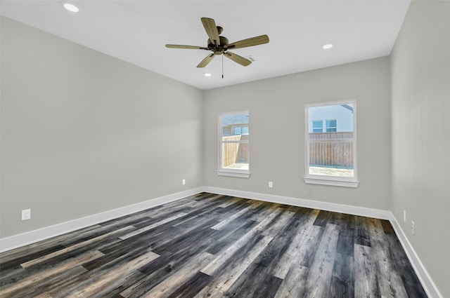 empty room featuring dark hardwood / wood-style flooring and ceiling fan