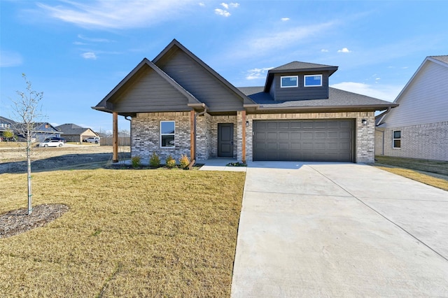 view of front of house featuring a front yard and a garage