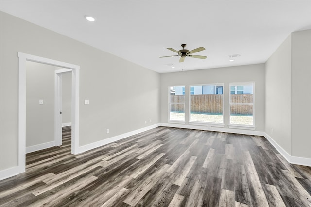 unfurnished room with dark wood-type flooring and ceiling fan