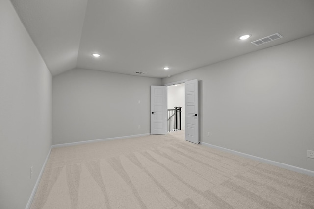 unfurnished room featuring recessed lighting, visible vents, light carpet, and baseboards