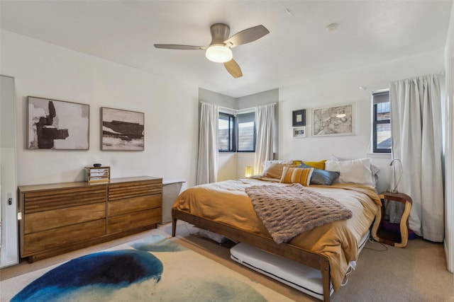 carpeted bedroom with ceiling fan