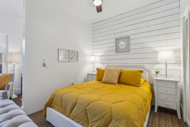 bedroom with ceiling fan and dark hardwood / wood-style floors