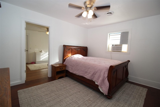 950 N Munday Ave, Munday, TX 76371 - bedroom featuring dark wood-type flooring, cooling unit, and ceiling fan