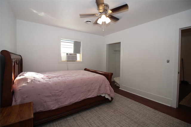 950 N Munday Ave, Munday, TX 76371 - bedroom featuring dark wood-type flooring, cooling unit, and ceiling fan