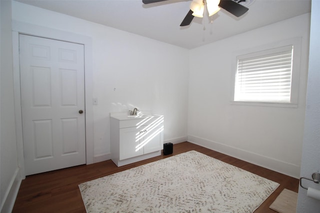 950 N Munday Ave, Munday, TX 76371 - interior space featuring ceiling fan and dark hardwood / wood-style flooring