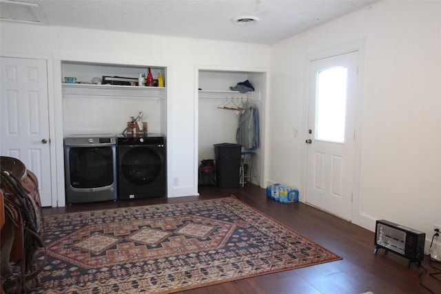 950 N Munday Ave, Munday, TX 76371 - clothes washing area with dark hardwood / wood-style flooring and washing machine and dryer