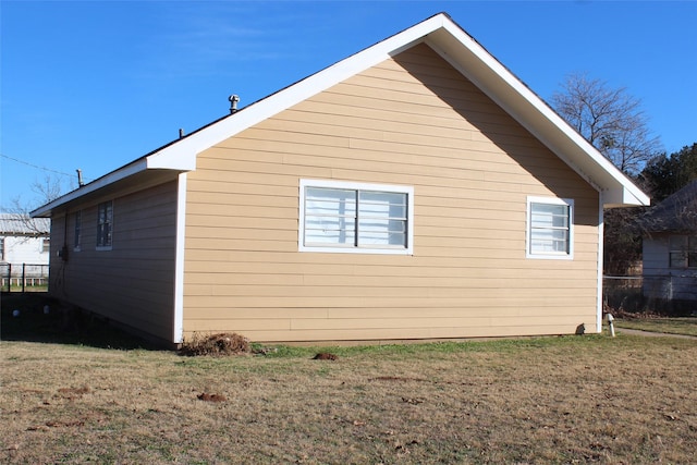 950 N Munday Ave, Munday, TX 76371 - view of property exterior with a lawn
