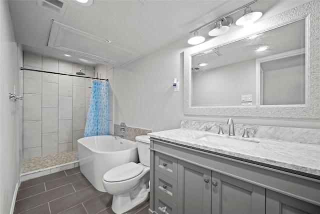 full bathroom featuring vanity, toilet, and plus walk in shower