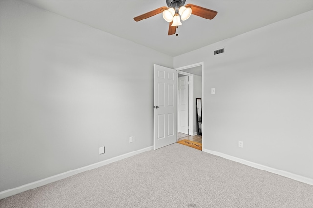 unfurnished room with carpet and ceiling fan