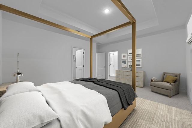 carpeted bedroom with a raised ceiling and ornamental molding