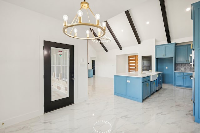 kitchen featuring blue cabinets, backsplash, hanging light fixtures, a notable chandelier, and beam ceiling