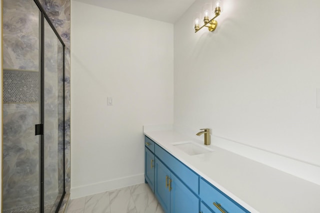 bathroom with vanity and a shower with door