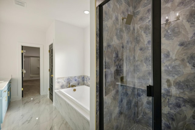 bathroom featuring vanity and separate shower and tub