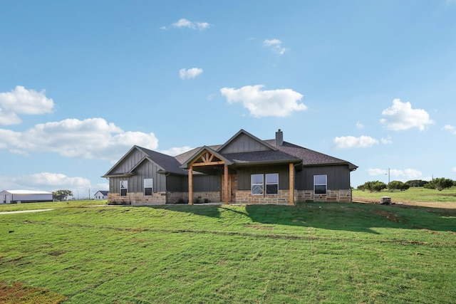 craftsman-style home with a front yard