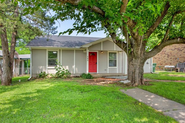 ranch-style house with a front lawn