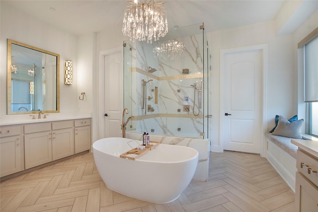 bathroom featuring vanity, a notable chandelier, parquet flooring, and separate shower and tub