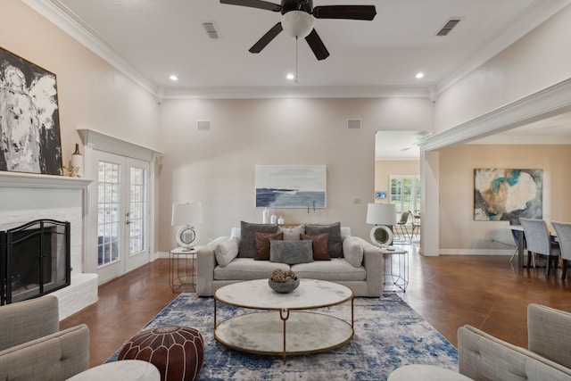 living room featuring french doors, plenty of natural light, ornamental molding, and ceiling fan