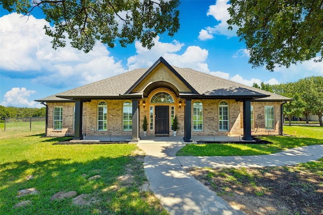 single story home featuring a front yard