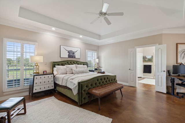 bedroom featuring a tray ceiling and ceiling fan