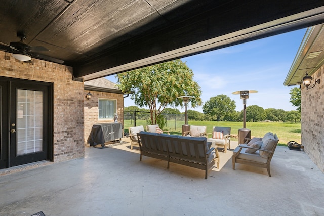 view of patio featuring an outdoor living space, ceiling fan, and area for grilling