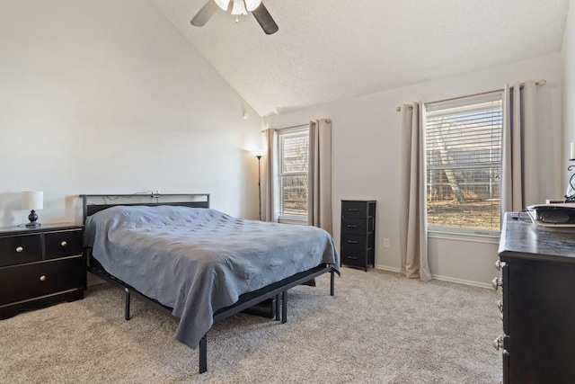 carpeted bedroom featuring vaulted ceiling, a textured ceiling, and ceiling fan