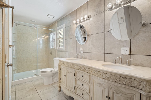 bathroom with tile walls, backsplash, an enclosed shower, toilet, and tile patterned floors