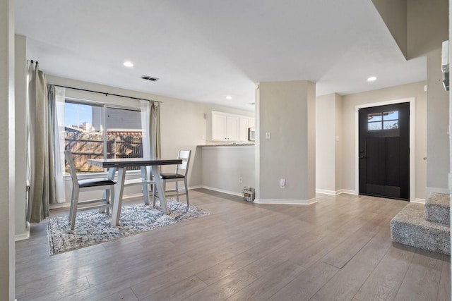 entryway with light hardwood / wood-style floors