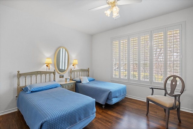 bedroom featuring ceiling fan, dark hardwood / wood-style floors, and multiple windows