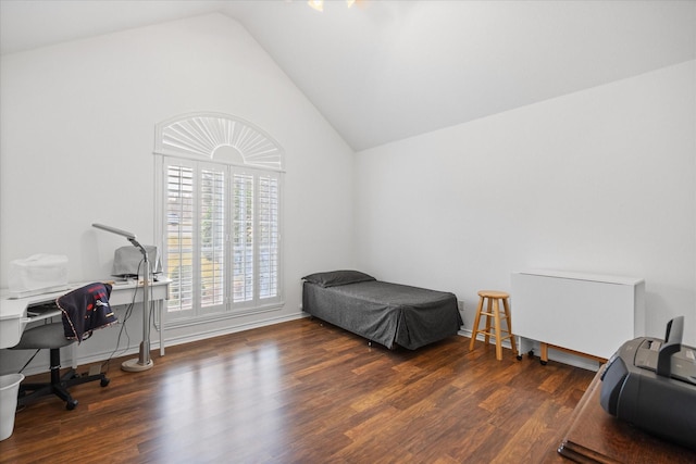 bedroom featuring dark wood-type flooring and lofted ceiling